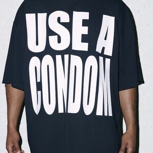 Savage X Fenty Black Tee with Large White 'USE A CONDOM' Graphic